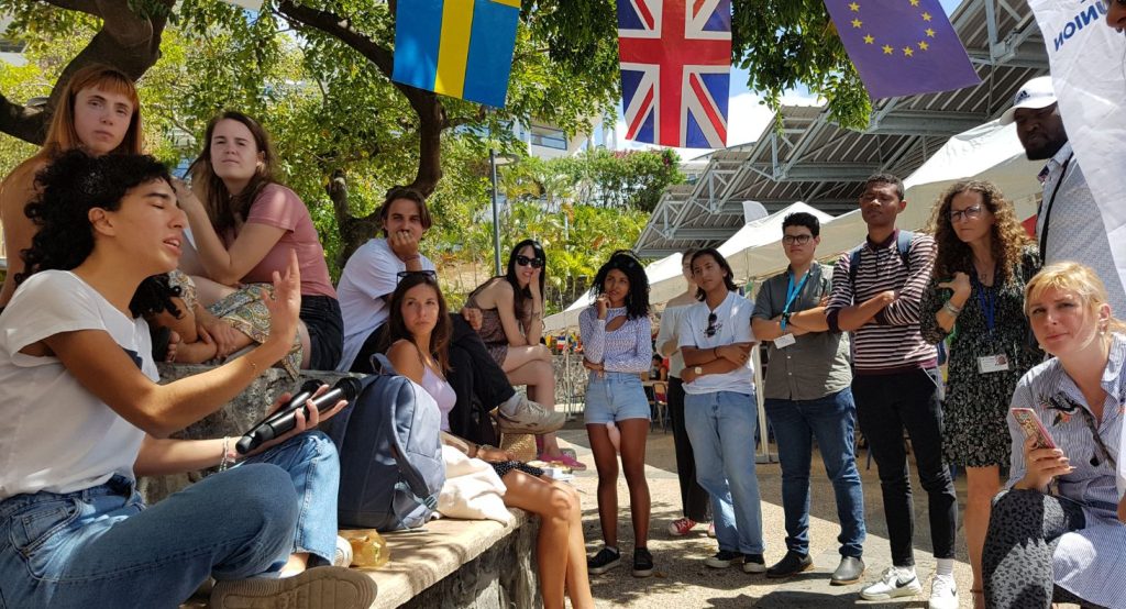 Photo of groups of students on the "Village of the World"